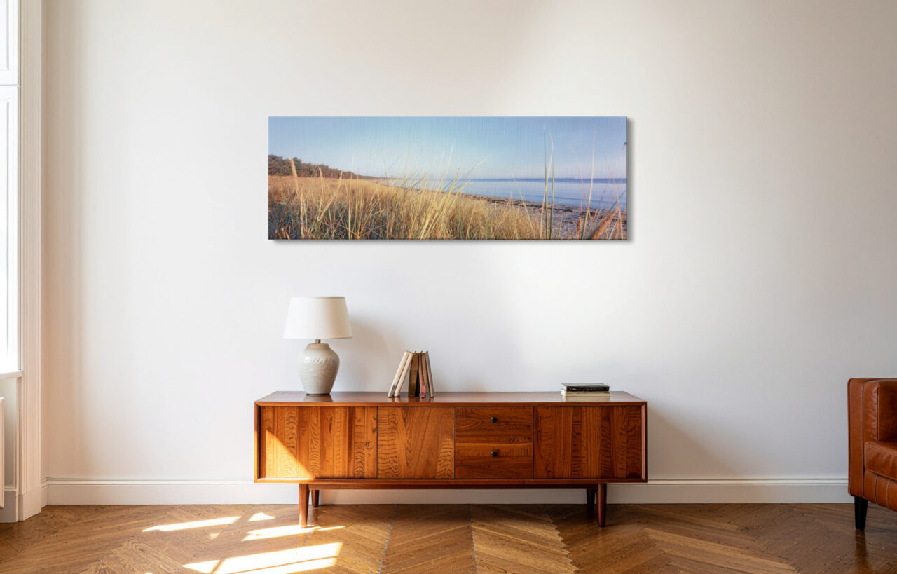 Leinwandbild Sonnige Dünen Schaabe über einem Sideboard im Wohnzimmer